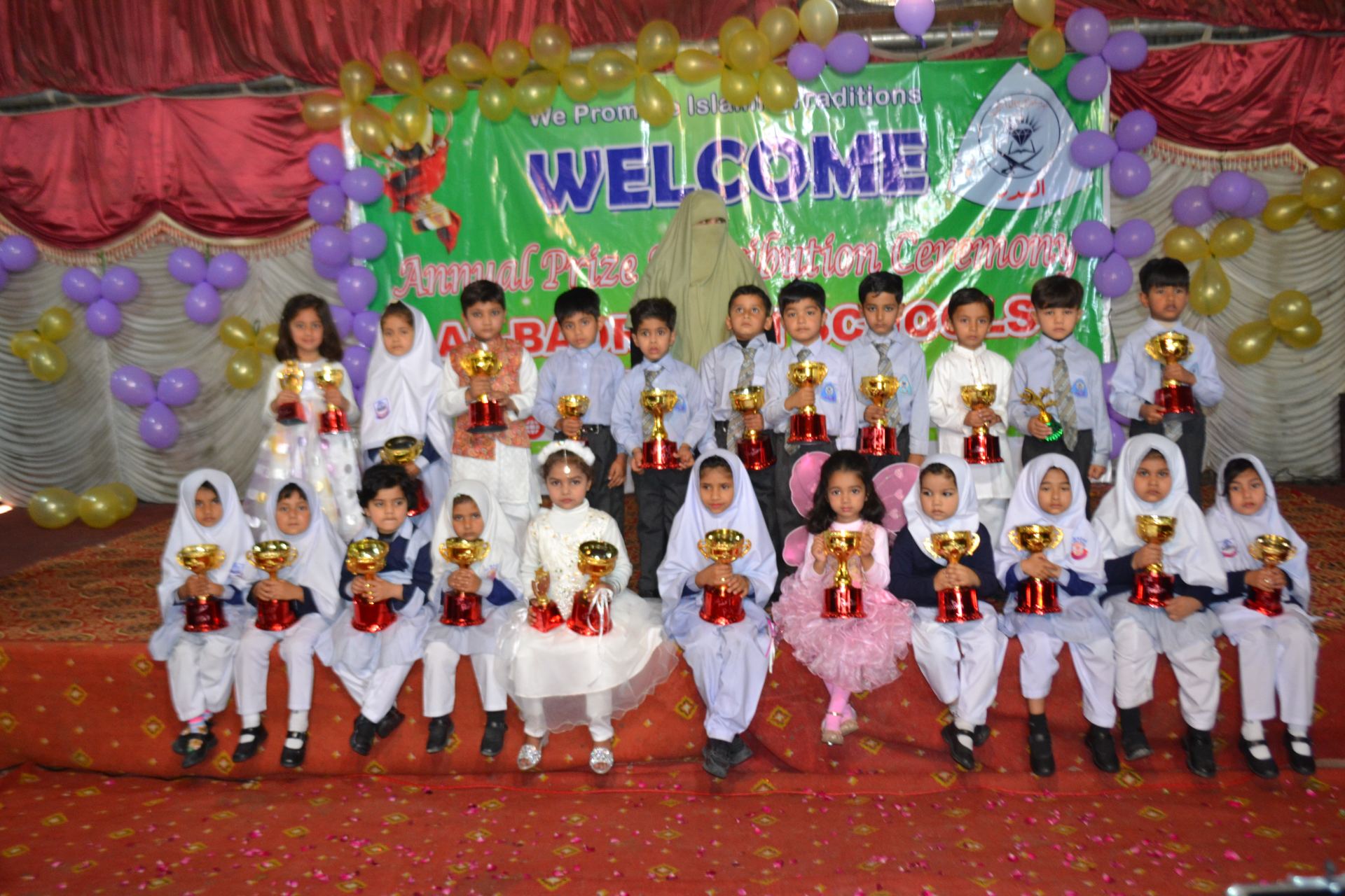 Students performing at an Al-Badr Schools ceremony